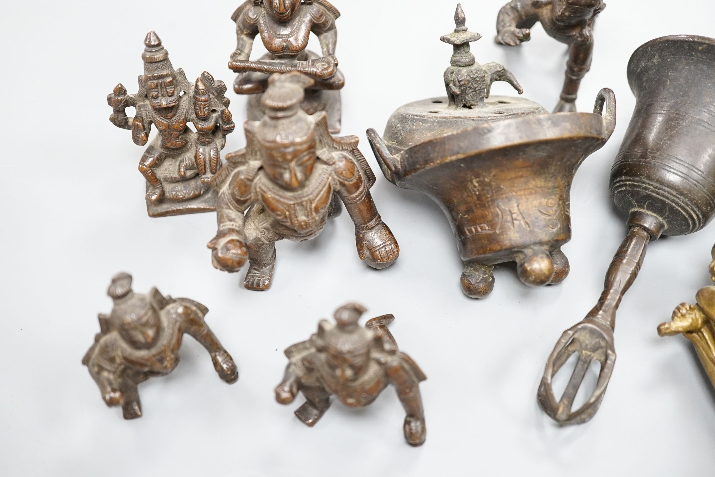 A Chinese gilt copper figure, a Chinese Dog of Fo, a bell, a censer, six Indian bronze figures and a scroll box